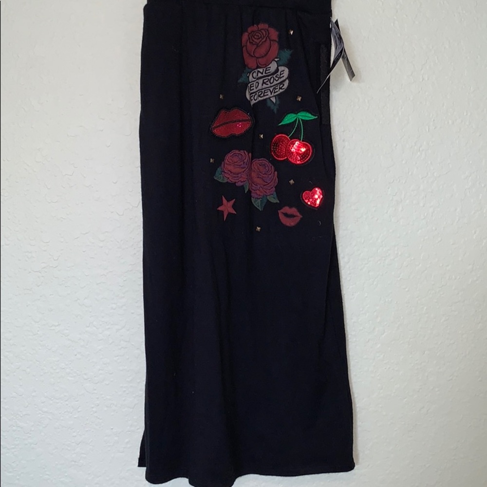 Girls black long skirt with red embellishments